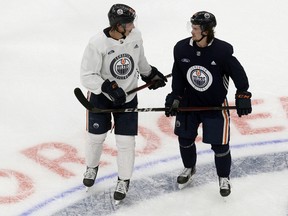 Ryan Nugent-Hopkins (93) and Kailer Yamamoto (56) take in the first day of Edmonton Oilers training camp for the 2019-20 NHL return to play initiative at Rogers Place in Edmonton on Monday July 13, 2020.
