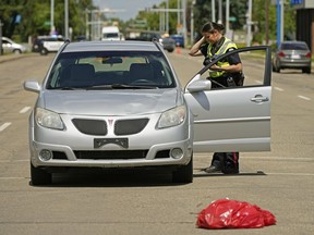 Police are investigating a crash involving a vehicle and a pedestrian at 124 Street and 112 Avenue in Edmonton on Monday July 6, 2020. An elderly pedestrian was struck at the pedestrian crosswalk and taken to hospital by ambulance with serious injuries.