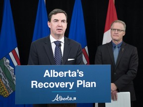 Minister of Labour and Immigration Jason Copping, and Associate Minister of Red Tape Reduction Grant Hunter,  announce, in Edmonton on July 7, 2020, Bill 32: Restoring Balance in Alberta's Workplaces Act.