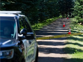 Edmonton Police Service officers investigate a suspicious death at an early morning social gathering being held at a rural residence near 184 Street and 8A Avenue SW in Edmonton on Friday, July 17, 2020.