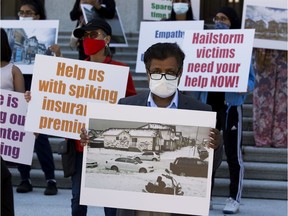 Protestors from the Hailstorm Action Committee and Victims of Calgary hailstorm convoy from NE Calgary stand on the steps of the Alberta Legislature as they demand government help for the damage they incurred during the storm.