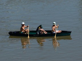 Canoeists make their way down the North Saskatchewan River on a hot day in Edmonton, on Tuesday, July 28, 2020.