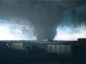 A massive tornado passes from south to north near 34 St., and 94 Ave., in Edmonton on Friday July 31, 1987. The tornado killed 27 people and injured hundreds
