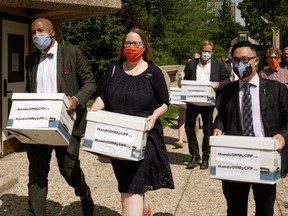 Members of the Opposition Alberta NDP delivered boxes of complaints, collected from Albertans concerned about their pensions, to the office of the Premier of Alberta at the Alberta Legislature in Edmonton on Thursday July 9, 2020.