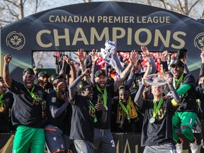 Forge FC players celebrate after defeating Cavalry FC during a Canadian Premier League soccer final match at Spruce Meadows in Calgary on Nov. 2, 2019.
