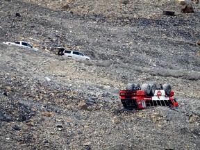 RCMP attend the scene of a sightseeing bus rollover at the Columbia Icefields near Jasper, Alta., Sunday, July 19, 2020.