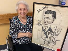 Marion Small and the caricature of her husband Bob drawn in 1962 by then-Journal editorial cartoonist Yardley Jones.
