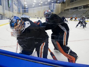 Goaltenders Mikko Koskinen (left) and Mike Smith take part in the Edmonton Oilers return-to-play camp at the Downtown Community Arena on Tuesday, July 14, 2020.