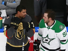 Ryan Reaves, left, of the Vegas Golden Knights and Tyler Seguin of the Dallas Stars talk ahead of their Western Conference round-robin game during the 2020 NHL Stanley Cup Playoffs at Rogers Place on August 03, 2020, in Edmonton.