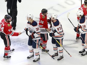 The Chicago Blackhawks and Edmonton Oilers shake hands following the Blackhawks 3-2 victory in Game 4 to win the Western Conference Qualification Round at Rogers Place on August 07, 2020.
