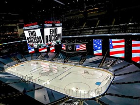"End Racism" is displayed on the scoreboard in light of the recent events in Kenosha, Wisconsin, in regards to the shooting of Jacob Blake, prior to Game Three of the Western Conference Second Round during the 2020 NHL Stanley Cup Playoffs at Rogers Place on August 26, 2020 in Edmonton, Alberta.