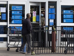A customer is turned away from the temporarily closed 3931 Calgary Trail Walmart Supercentre, in Edmonton Tuesday Sept. 1, 2020. Eight employees at the location have tested positive for COVID-19. 426 new cases were reported in Alberta over the weekend. Photo by David Bloom