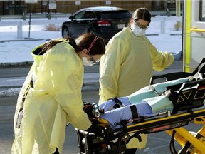 Paramedics at work in downtown Edmonton during the COVID-19 pandemic on April 2, 2020.