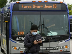 A transit rider at the West Edmonton Mall bus terminal on June 15, 2020.