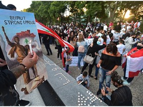 The Lebanese community organized a candlelight vigil for the victims of the deadly explosion in Beirut at the Alberta legislature in Edmonton on Saturday, Aug. 8, 2020.