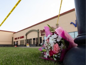 RCMP officers investigate a homicide at the Village Mall Clinic in Red Deer, south of Edmonton, on Monday, Aug. 10, 2020. A man was taken into custody.