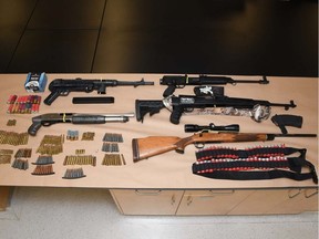 Edmonton police have arrested and charged a 34-year-old man with multiple firearm-related offences, and seized a number of various firearms and ammunition. Supplied photo/EPS