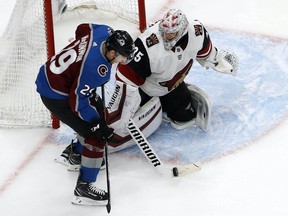 Arizona Coyotes goaltender Darcy Kuemper blocks a shot against Colorado Avalanche centre Nathan MacKinnon during the third period in Game 2 of their playoff series at Rogers Place on Friday.