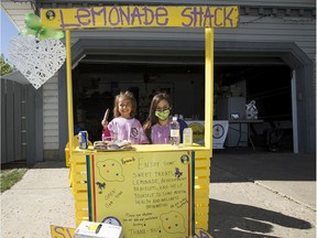 Three months after the death of her daughter Bella, Melissa Desrosiers and her daughter Lily,5, carry on Bella's tradition of hosting a lemonade stand in support of art therapy at the Stollery Children's Hospital. Bella was stabbed by a family friend on May 18th. Taken on Sunday, Aug. 30, 2020  in Edmonton.  Greg Southam/Postmedia