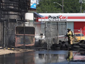 Edmonton firefighters battle a tire fire at the Trail Tire, 10550 116 St NW, in central Edmonton on Sunday, Aug. 2, 2020.