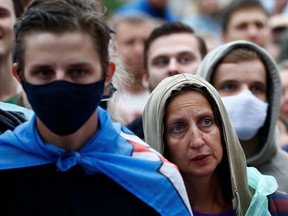 People attend an opposition demonstration to protest against presidential election results at the Independence Square in Minsk, Belarus, Aug. 25, 2020.