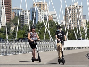 Carrie Friesen receives a lesson from Bird Canada tech. Chandler Friesen, in Edmonton Tuesday July 28, 2020. Bird Canada celebrated one year of operations in Edmonton with an e-scooter public safety demonstration near the Walterdale Bridge.