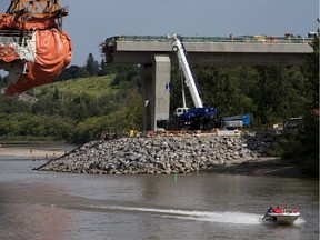 Boaters make their way up the North Saskatchewan River past the under construction Tawatinâ Bridge, Sunday Aug. 2, 2020.