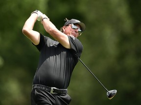 Phil Mickelson tees off on the second hole during the final round of the World Golf Championship-FedEx St. Jude Invitational on Sunday. Mickelson, who finished second and is ready to compete in this week's PGA Championship, says it's "exciting that we're going to be able to compete in three majors" this season.