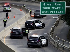 Emergency crews work at the scene of a motorcycle crash resulting in serious injuries along Groat Road, in Edmonton Monday Aug. 31, 2020. Photo by David Bloom