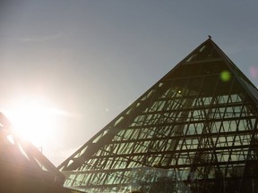 The sun peeks from behind the pyramids at Edmonton's Muttart Conservatory on Aug. 4, 2020.