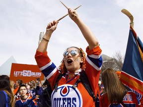 Fans cheer at Sir Winston Churchill Square downtown  during the Edmonton Oilers' Orange Crush community rally on April 20, 2017.