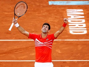 Serbia's Novak Djokovic celebrates winning the final against Greece's Stefanos Tsitsipas