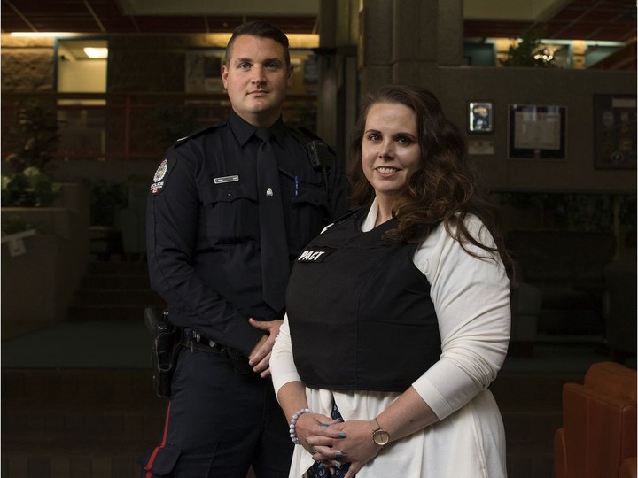  EPS Police and Crisis Response Team (PACT) members Cst. Andrew Frey and Tanya Anderson, a psychologist with Alberta Health Services, pose for a photo in Edmonton Thursday June 25, 2020.