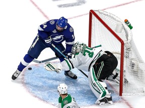 Anton Khudobin (35) of the Dallas Stars makes the save against Pat Maroon (14) of the Tampa Bay Lightning in Game 2 of the 2020 NHL Stanley Cup Final at Rogers Place on Sept. 21, 2020.