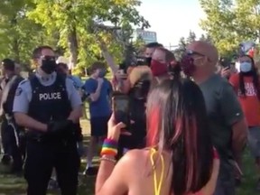 One man has been charged and police are awaiting a summons to be served against a second individual following three separate assaults during an anti-racism rally in Red Deer.