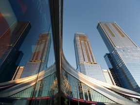 The Stantec Tower and JW Marriott hotel buildings are seen in the background as the sun sets outside of Rogers Place. The buildings was recognized in Engineering News-Record's eighth annual Global Best Projects competition.