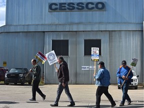 Employees walk the picket line outside the CESSCO  manufacturing plant Sept. 8, 2020 after being locked out by the company.