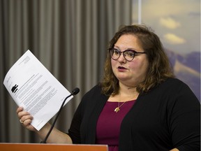 NDP education critic Sarah Hoffman holds a FOIP document on Tuesday, Sept. 15, 2020, that she says reveal that Education Minister Adriana LaGrange is hiding documents related to the COVID-19 response.