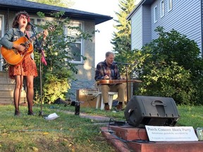 Kimberley MacGregor and Elliot Thomas perform at a porch concert block party in Allendale on Friday, Sept. 11.