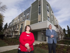Carola Cunningham, CEO of Niginan Housing Ventures. and Cam McDonald, executive director of Right at Home Housing Society, stand in front of the new supportive housing facility in Belvedere, Sept. 28, 2020.