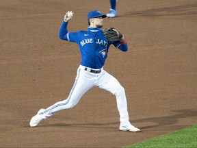 Toronto Blue Jays third baseman Cavan Biggio (8) throws to retire New York Yankees third baseman Gio Urshela (not pictured) after feeding a ground ball during the fourth inning at Sahlen Field in Buffalo, New York, September 24, 2020.