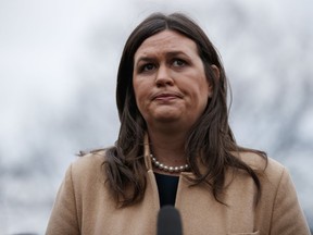 Former White House press secretary Sarah Huckabee Sanders talks with reporters outside the White House, Wednesday, Jan. 9, 2019, in Washington.