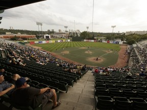 Fans watch from the stands during a playoff game between the Edmonton Prospects and Okotoks Dawgs at Re/Max Field in Edmonton in this file photo from 2016.