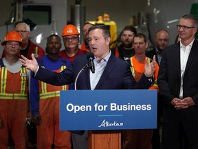 Alberta Premier Jason Kenney (middle) and Alberta Finance Minister Travis Toews (right) announced at Lafarge Infrastructure in Edmonton on Monday May 13, 2019 that their government plans to create jobs in the province by having the lowest corporate business tax rate in Canada.
