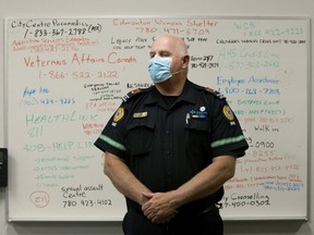 Edmonton Zone peer support paramedic Mark Carson is surrounded by emergency contact numbers aat the Queen Mary Park EMS Station, in Edmonton on Wednesday Sept. 9, 2020.