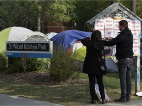 Supporters of the Peace Camp in Dr. Wilbert McIntyre Park put up posters on Sept. 18 when the city was intending to remove the camp. The camp has now relocated two blocks north to Light Horse Park.