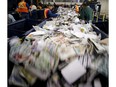 Plastics, paper and cans are seperated mechanically and by hand at the Edmonton Waste Management Centre. File photo.