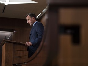 Minister of Finance Bill Morneau announces his resignation during a news conference on Parliament Hill in Ottawa, on Monday, Aug. 17, 2020. Canada's election watchdog says former finance minister Bill Morneau broke the law when he promoted Liberal candidates at events he attended while in charge of the finance portfolio.