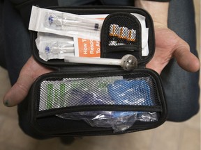 Current meth user Codey Gibbons, 39, displays the Naloxone kit he keeps tucked up his sleeve, at the Boyle Street Community Centre, 10116 105 Ave., in Edmonton Tuesday Feb. 18, 2020. Gibbons also carries his meth pipe inside the Naloxone kit.
