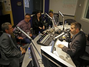 Edmonton's newly-elected city councillors (left to right) Tim Cartmell, Jon Dziadyk, Sarah Hamilton and Aaron Paquette talk to 630 CHED radio show host Ryan Jespersen (right) at the station on Tuesday Oct. 17, 2017.